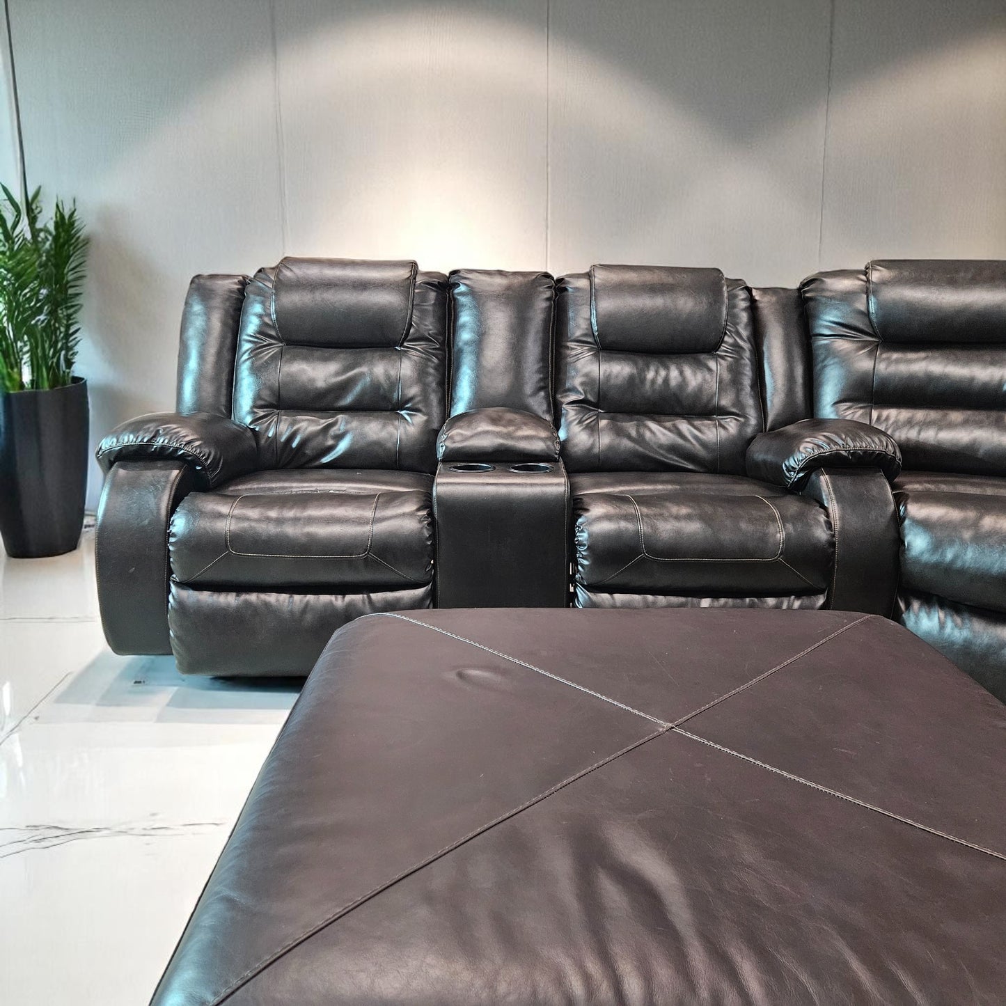 Black Leather Sectional + Ottoman