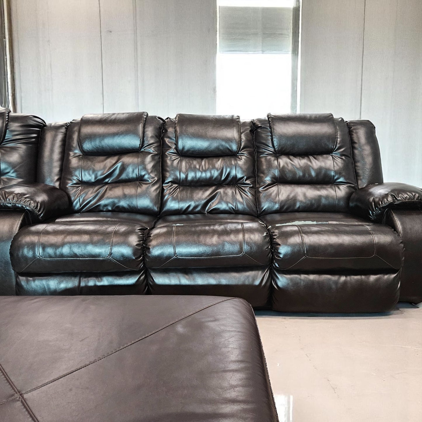 Black Leather Sectional + Ottoman